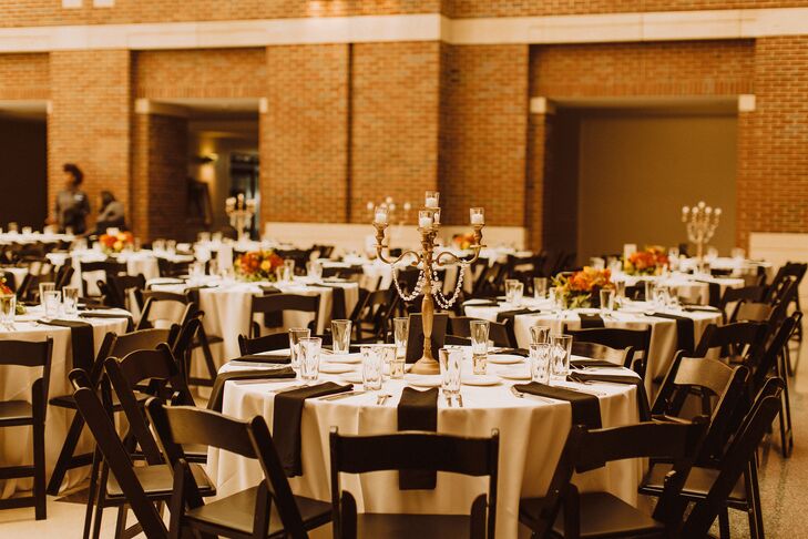 Simple Reception Decor With Folding Chairs and Candelabras