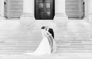 Newlyweds Kiss on the Steps of a Museum