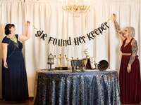 Brown banner saying She found her keeper in HP font