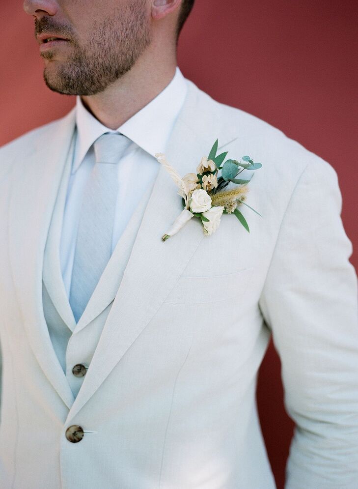 Groom in Cream Suit With Pale Blue Tie