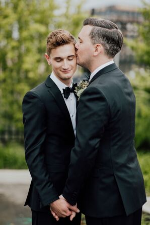 Grooms Embrace Outside of the Venue