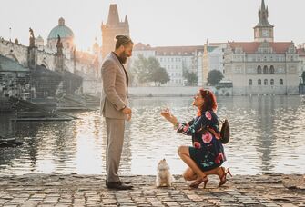 Woman proposing to man with dog