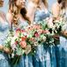 Bridesmaids in Light Blue Dresses With Colorful Bouquets