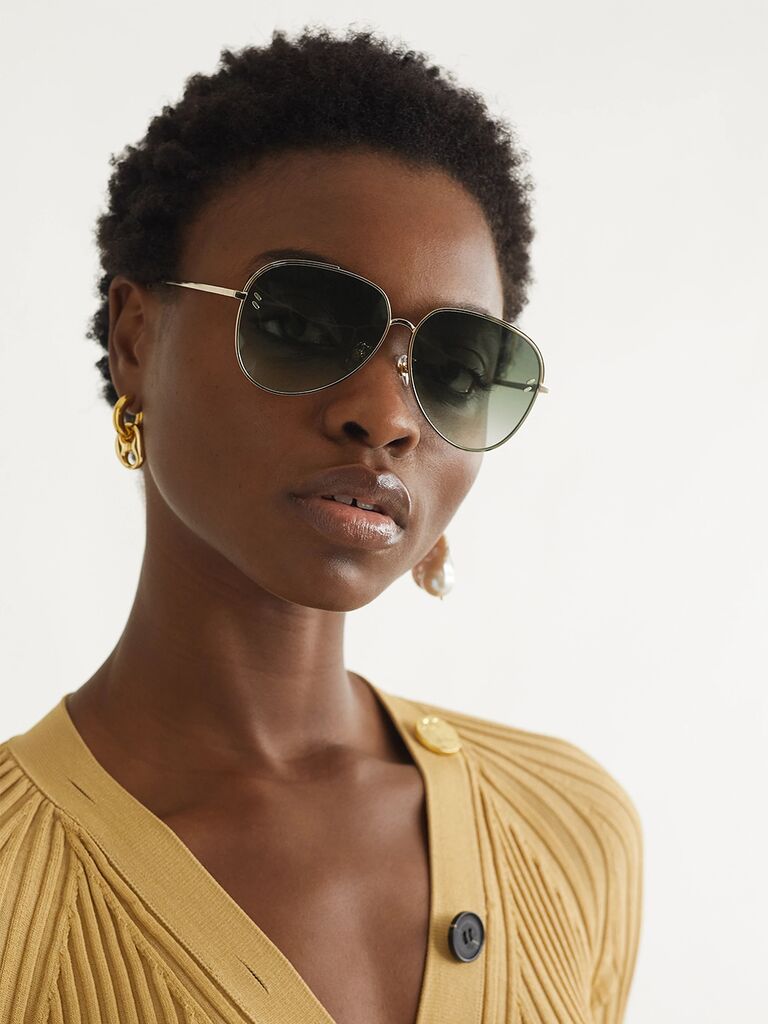 Aviator sunglasses with gold frames and ombre green-tone lenses 