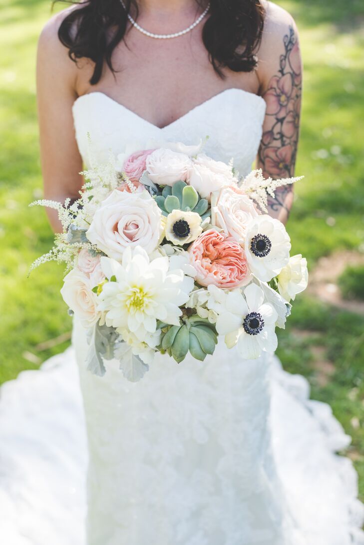 Sarah held an ivory, green and pink bouquet filled with chrysanthemum, roses, anemones and succulents.