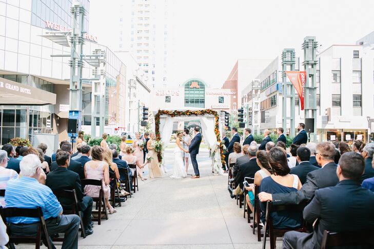Claire and Rob knew they didn't want a hotel ballroom. After looking at several venues, they decided Peace Plaza in downtown Rochester, Minnesota, was the perfect blank canvas for them to work with. Plus, they knew their event designer could make a stunning backdrop, and they were right.