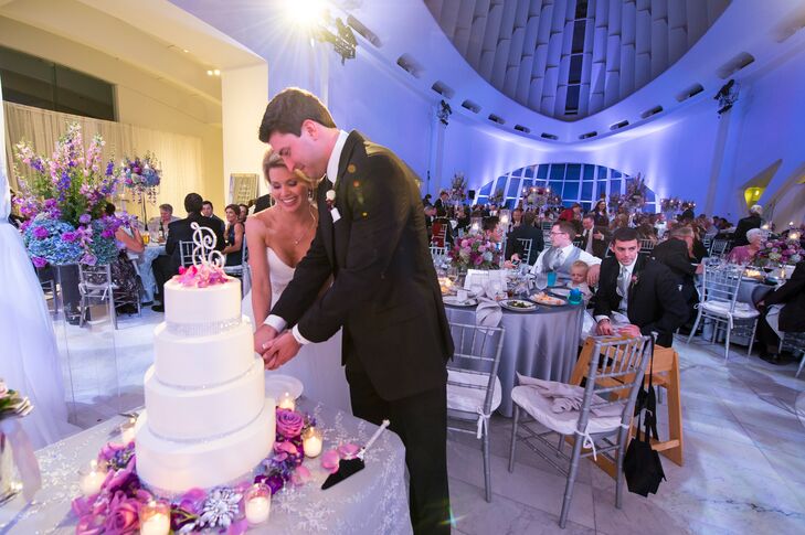 Jenna and Tom's wedding at Milwaukee Art Museum in Milwaukee, Wisconsin, was everything they imagined and more. "The art museum was the only venue that offered everything we were looking for: Lake Michigan and city views, full and private use of the venue, indoor and outdoor event space, in-house exceptional catering and a blank canvas on which to create our own sense of style," Jenna says.