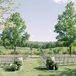 Garden Wedding Ceremony Setup With Wrought Iron Chairs