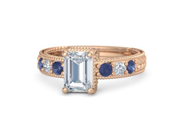 Emerald cut center diamond and round sapphires and diamonds on gold band