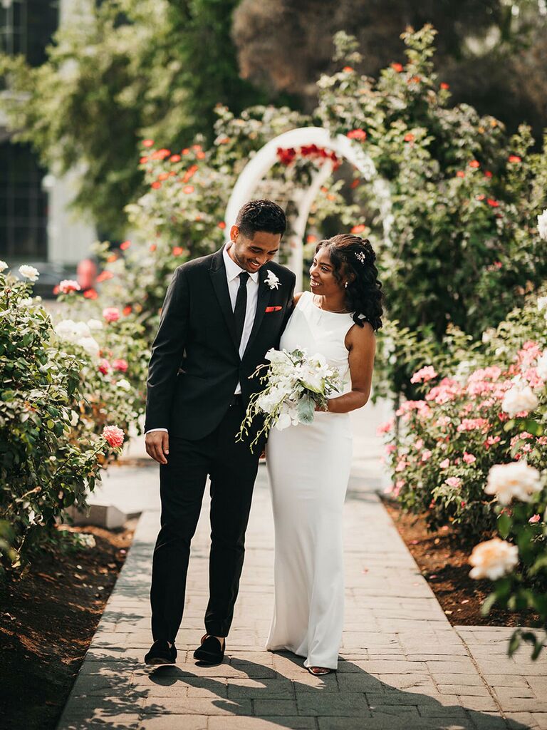 Bride holding monochrome white bouquet at summer wedding