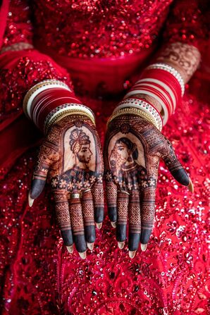 Bride in Traditional Red Indian Attire With Red Bangles and Henna