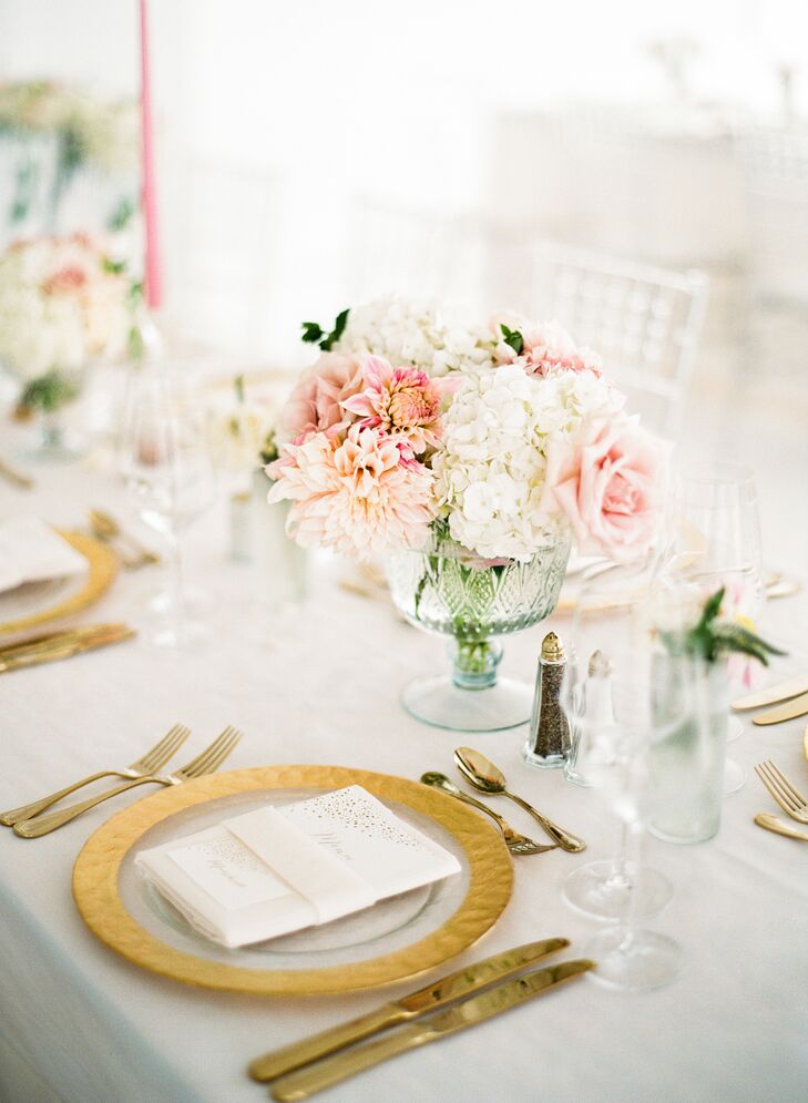 Shades of soft blush dominated the reception decor, the romantic hue materializing in lush arrangements of dahlias, roses and hydrangeas displayed in shimmering mercury-glass vases. While the centerpieces were essential in bringing Mia and Jake’s vision to life, it was a wisteria ceiling installment over the dance floor that truly stole the show.