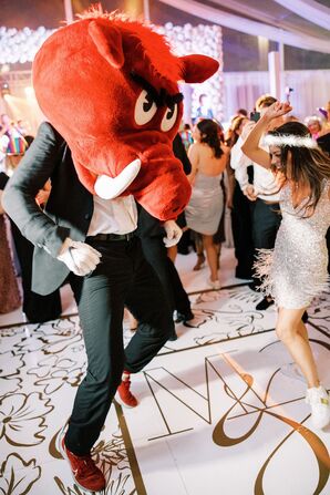 Bride in Mini Dress and Groom Wearing an Arkansas Razorback Mascot Big Red Head