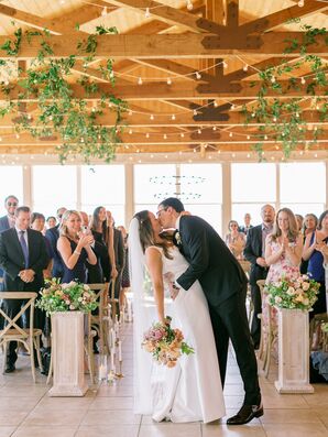 Couple Kissing During Recessional at Cordiano Winery in Escondido, California