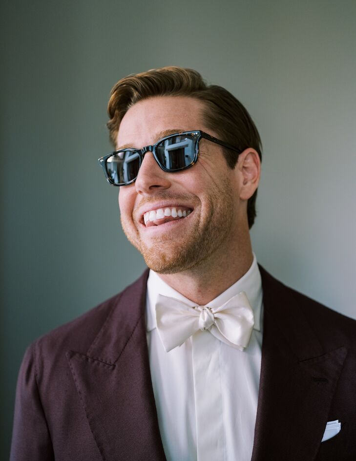 Groom in Dark Maroon Suit Jacket, Light Bow Tie and Sunglasses, Close Up