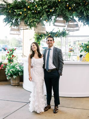 Bride in Full-Length White Dress, Groom in Blue Suit at Italian Rehearsal Dinner