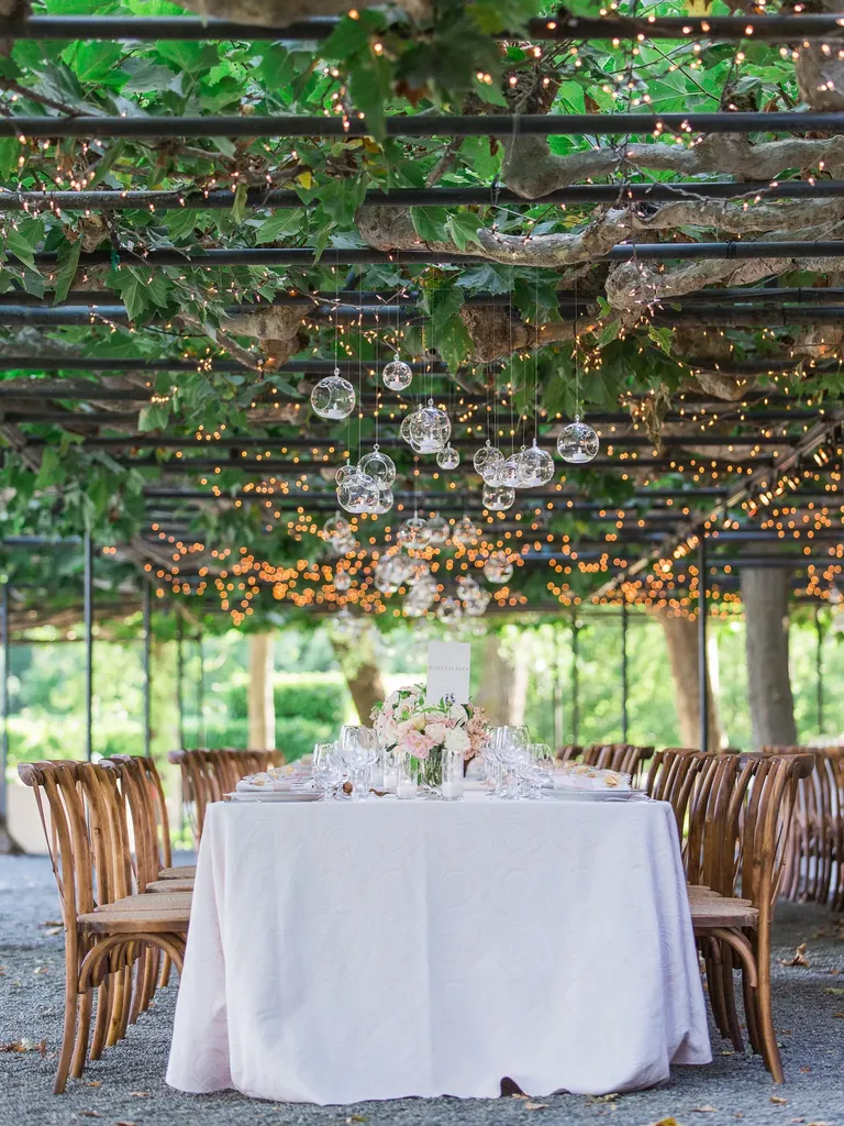 Low Arbor With String Lights wedding lighting idea