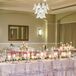 Romantic Wedding Reception With Candles, Lucite Chairs and Lush Centerpieces