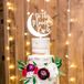 Tiered Rustic Cake with Celestial-Themed Cake Topper and Flowers