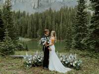 Couple standing in the middle of a woodland forest wedding venue