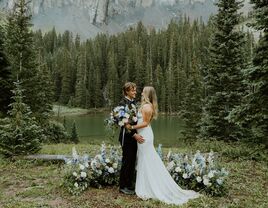 Couple standing in the middle of a woodland forest wedding venue