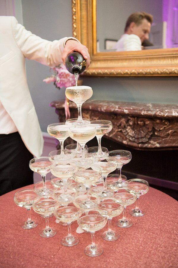 The couple kicked off the reception with a traditional champagne tower.