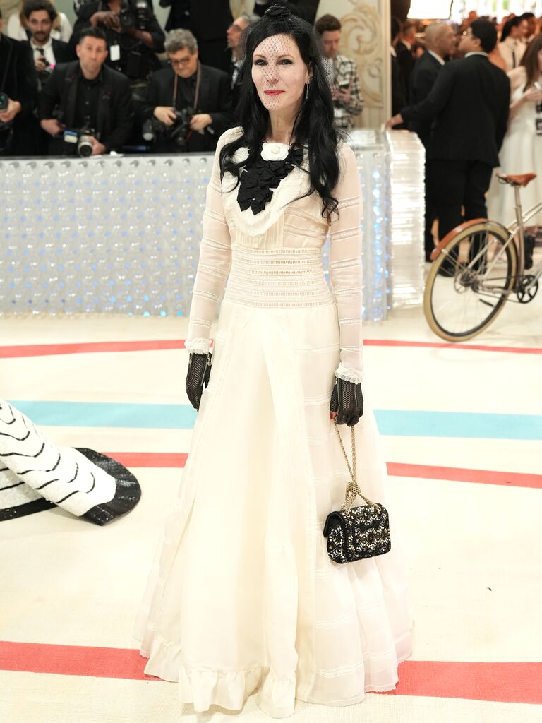 Jill Kargman wears a long-sleeved Chanel wedding dress. 