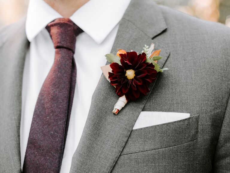 A romantic wine-colored cosmo flower boutonniere