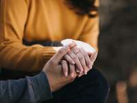 Man and woman holding hands.