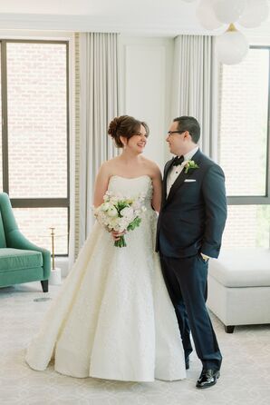 Bride in Sophisticated Updo, Bouquet and Groom in Dark Tuxedo, Boutonniere