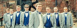 Groom and Groomsmen in Gray Tuxedos and Blue Bow Ties