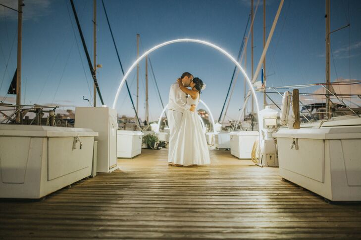 The couple's first dance was to Bobby Darin's “Beyond the Sea,” a fitting song for a nautical couple at their nautical-themed wedding at Detroit Yacht Club in Detroit, Michigan.