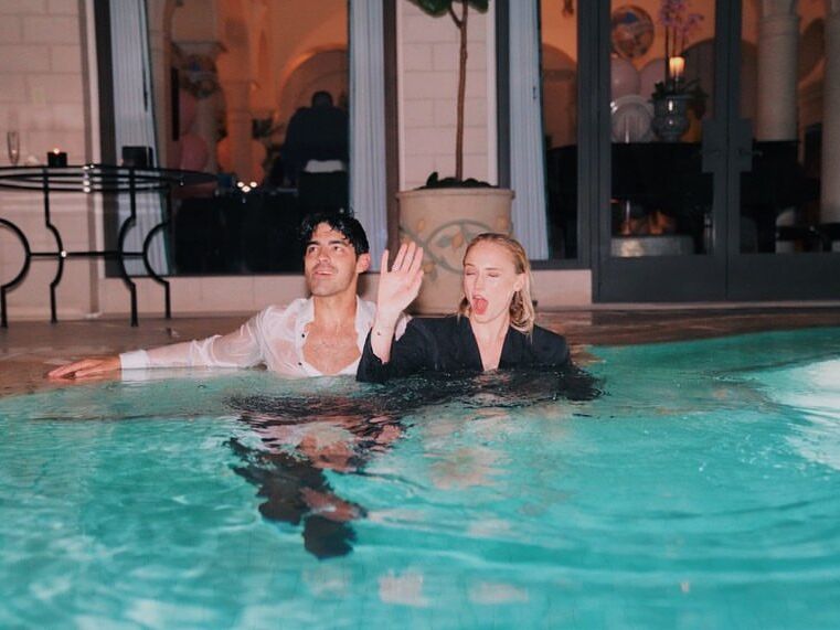 Joe Jonas and Sophie Turner in the pool on their wedding day.