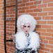 Wedding Officiant Dressed as Effie Trinket From "The Hunger Games"