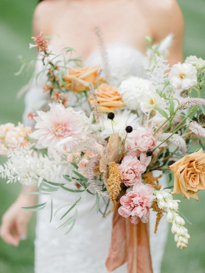 Orange-hued wildflower wedding bouquet