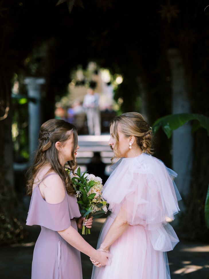 Bride in Blush Pink Tulle Gown Holds Hands With Daughter in Lavender Dress, Bouquet