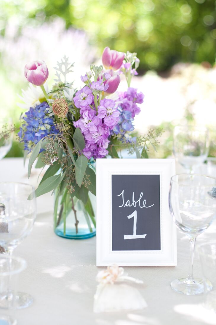Blue vases held small arrangements of tulips, snapdragons and hydrangeas. The mix had a fresh just-picked feel.