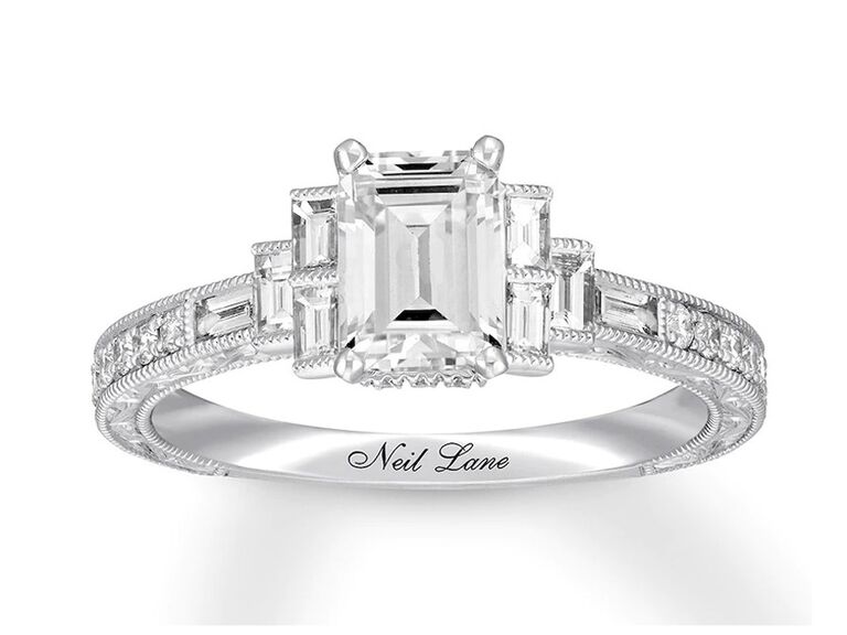 kay neil lane art deco emerald cut diamond engagement ring with claw prongs baguette side diamonds and round and baguette diamond white gold band