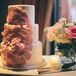 Pink Sugar Flowers on Three Tier White Cake