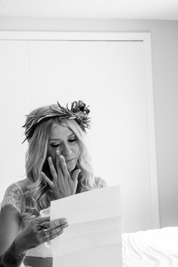 Christa's headpiece added to her bohemian bridal look. It was made with green eucalyptus leaves and air plants.