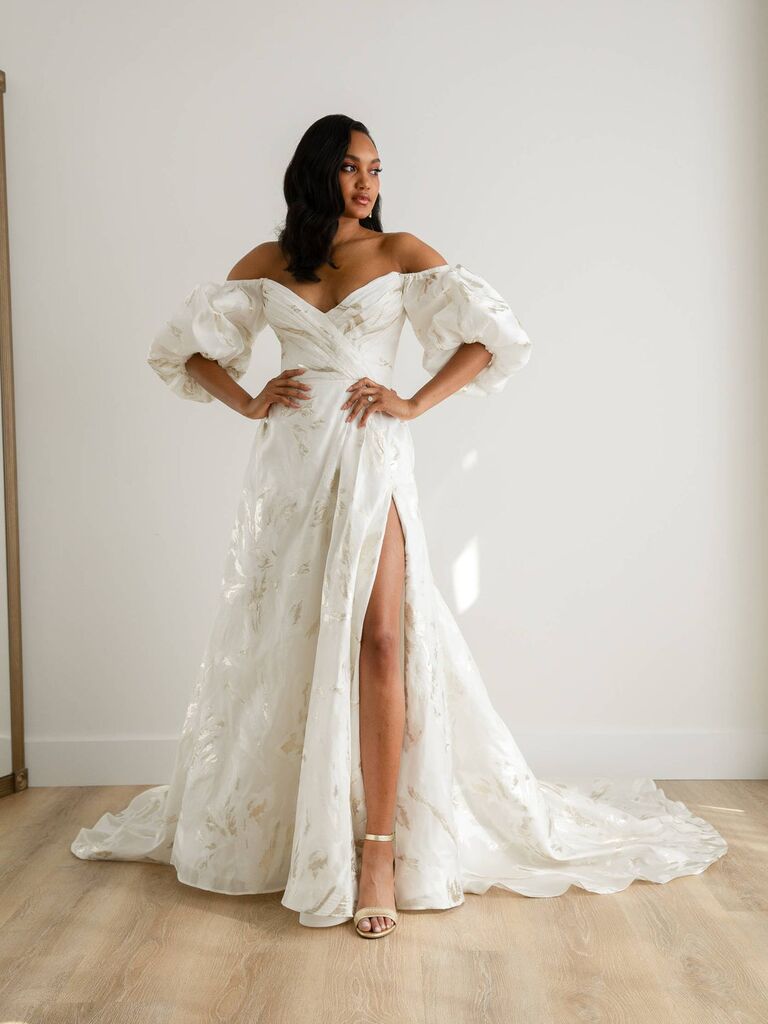 White and gold wedding dress by Rebecca Schoneveld. 