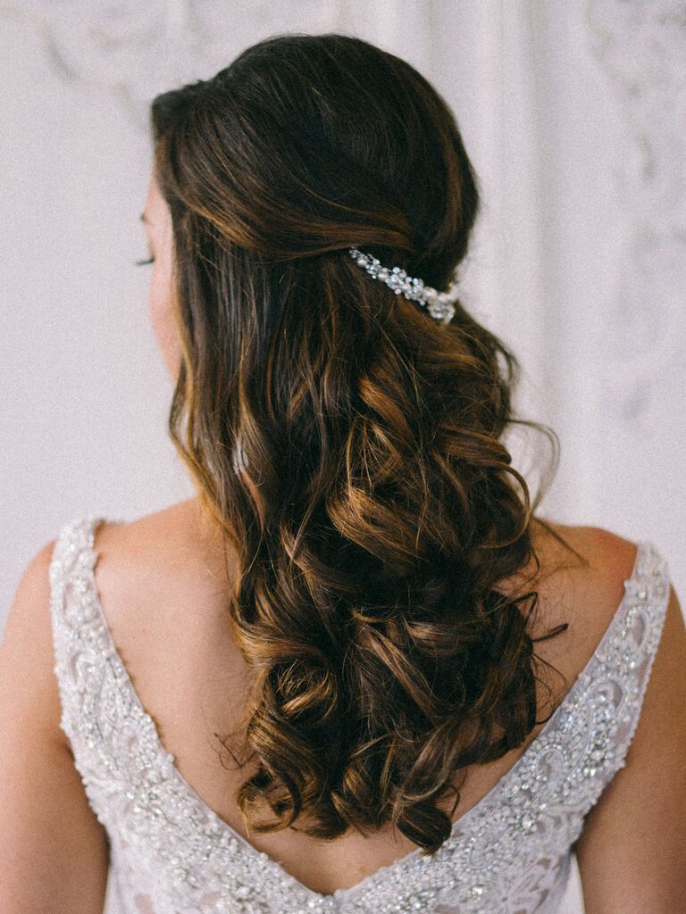 Image of Half up, half down hairstyle with a barrette on frock