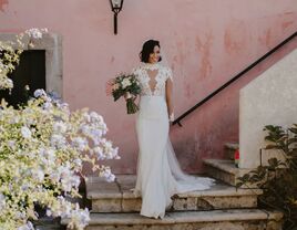 Photo of bride holding bouquet on steps