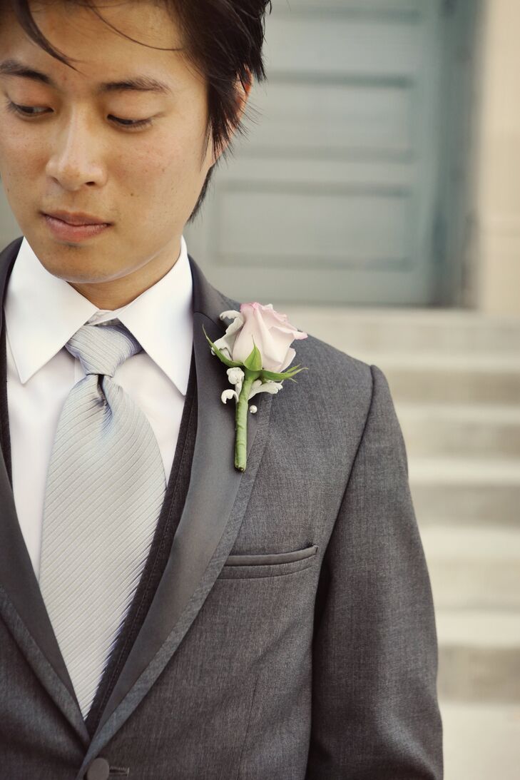 The guys wore a single rose bloom on their lapels.