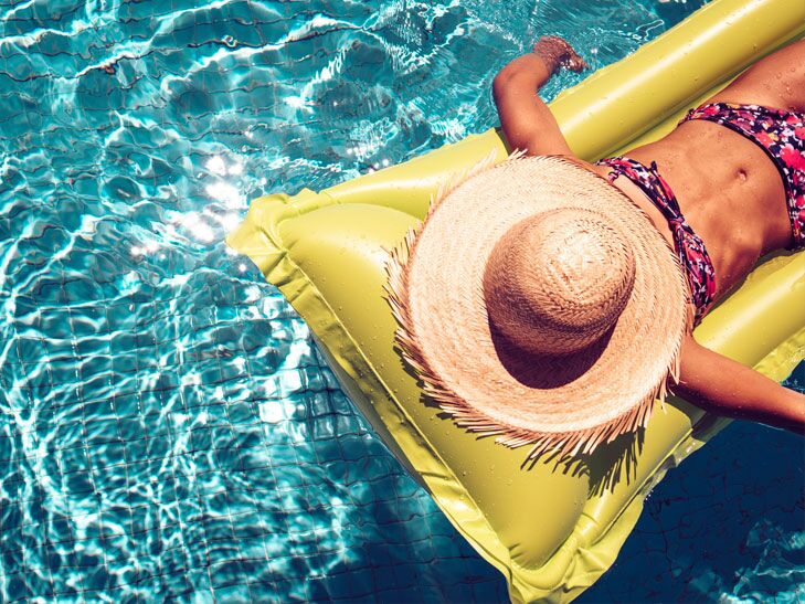 woman floating in the pool
