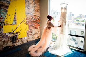 Bride in Luxurious Pink Ruffled Robe Admiring Wedding Dress in the Window, Cityscape
