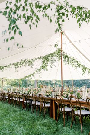 Long Head Table With Low Pastel Centerpieces, Taper Candles Under Tent and Hanging Greenery, String Lights