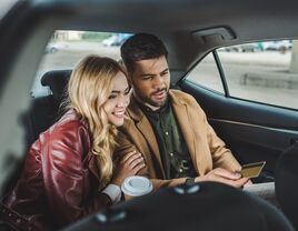 couple car backseat smiling