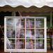 Instead of traditional escort cards, Nellie's mom wrote everybody's name and seating assignments on a vintage window pane.