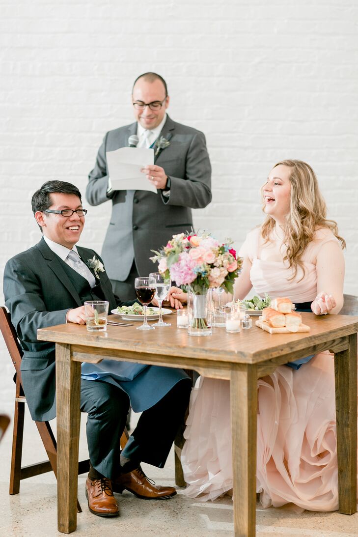 Mary and Jav sat at their own small table during the reception at Chez in Chicago, Illinois.